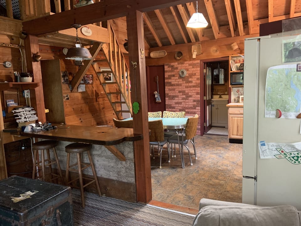kitchen view from living room with "captains ladder" to loft
