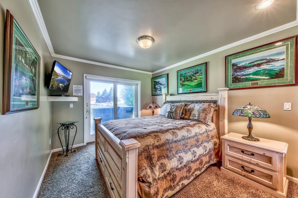 Your cozy bedroom retreat features warm wood furnishings, nature-inspired artwork, and all the comforts you need for peaceful rest.
