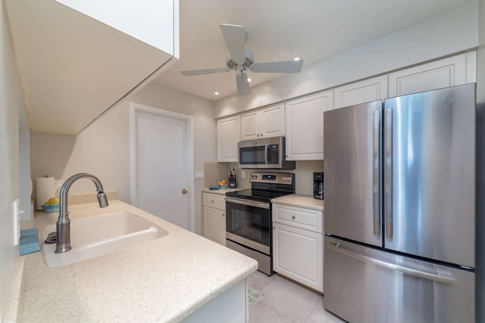 The kitchen boasts brand new stainless steel appliances, cookware & utensils that will make preparing a meal enjoyable.
