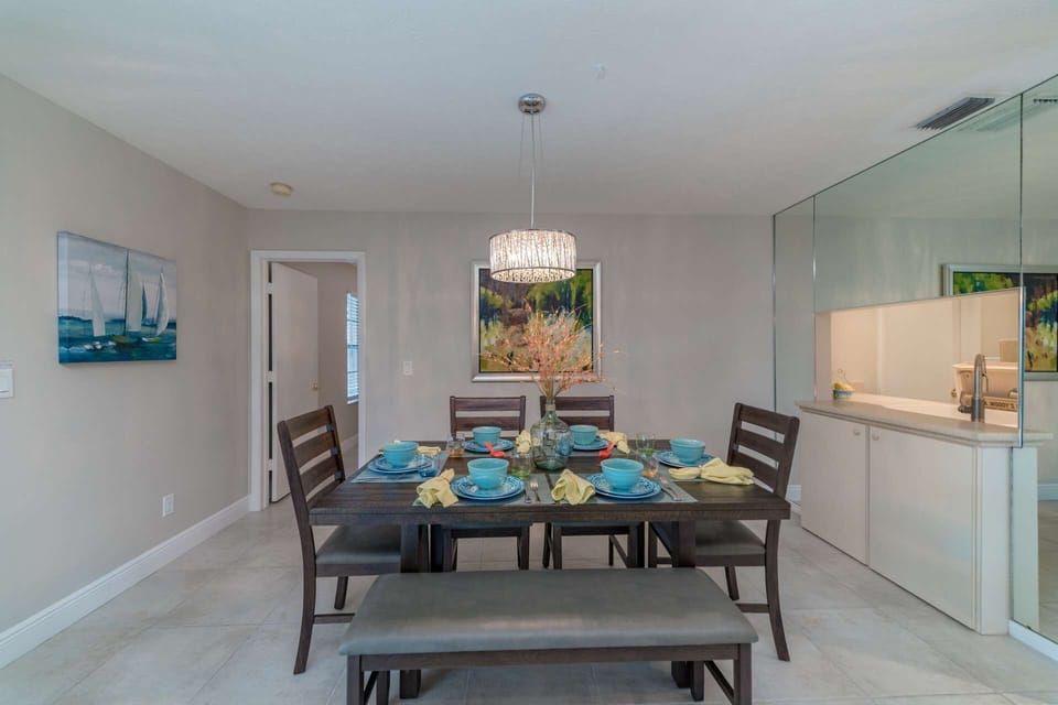 The dining room off the kitchen and across from the pool table is a great place for hosting a family meal.
