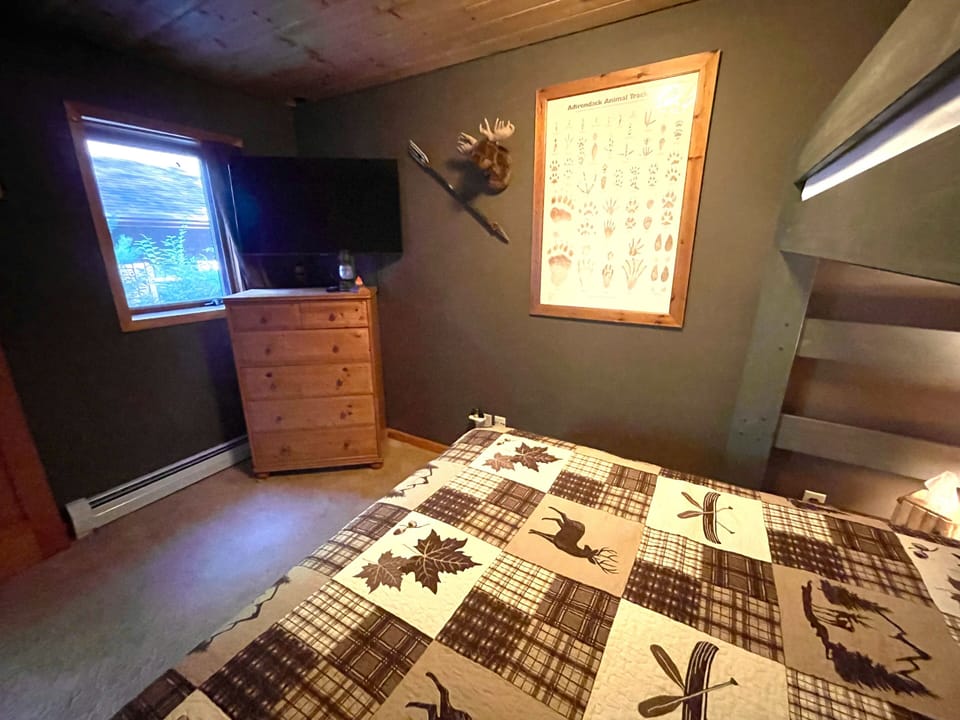 Bedroom #4 with smart tv and dresser. All rooms have blackout shades and fans.