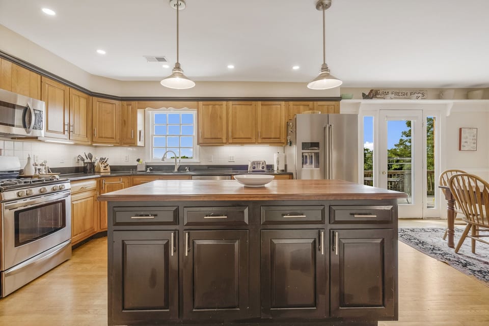 Pots, pans and everything else to cook with inside the island cabinets.