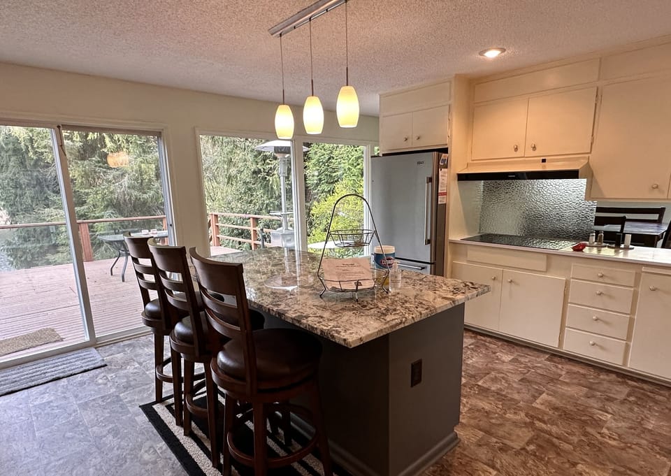 Cook with new appliances while looking out on the deck and the lake. 