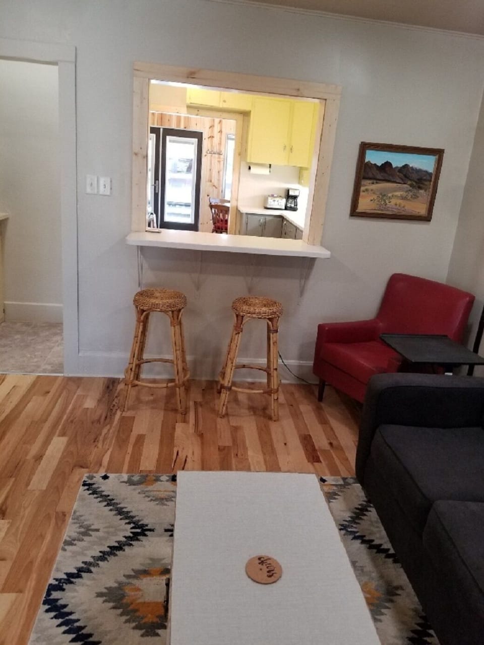 Looking south into kitchen from living room to the dining/great room