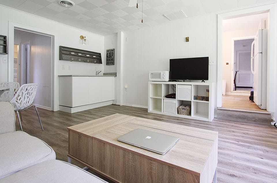 Den with pop uo coffee table to eat or use laptop