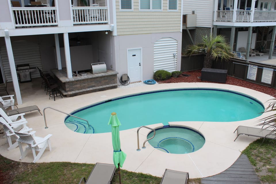Pool.  Lots of poolside seating.  Stone bar with built-in grill under deck. 