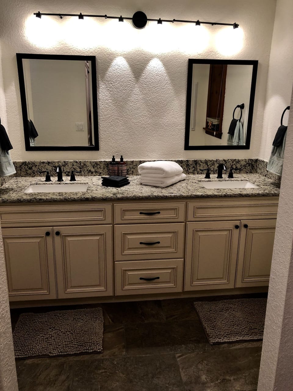His/Ber bathroom sink- towels, soap and lotion provided.
