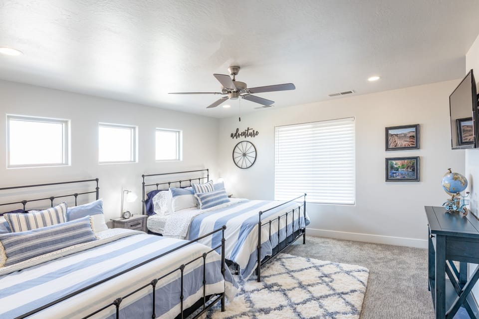 Bedroom 4 - Bedroom 4 is a large bedroom which includes two queen beds, walk-in closet and private TV.