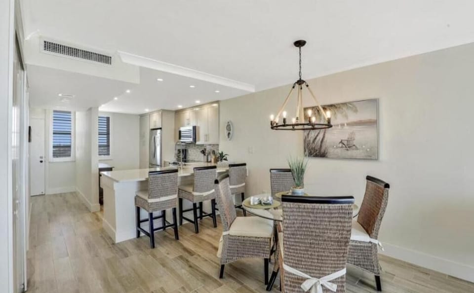 Dining Area and Counter Seating. Entry Door shows on the Left Side