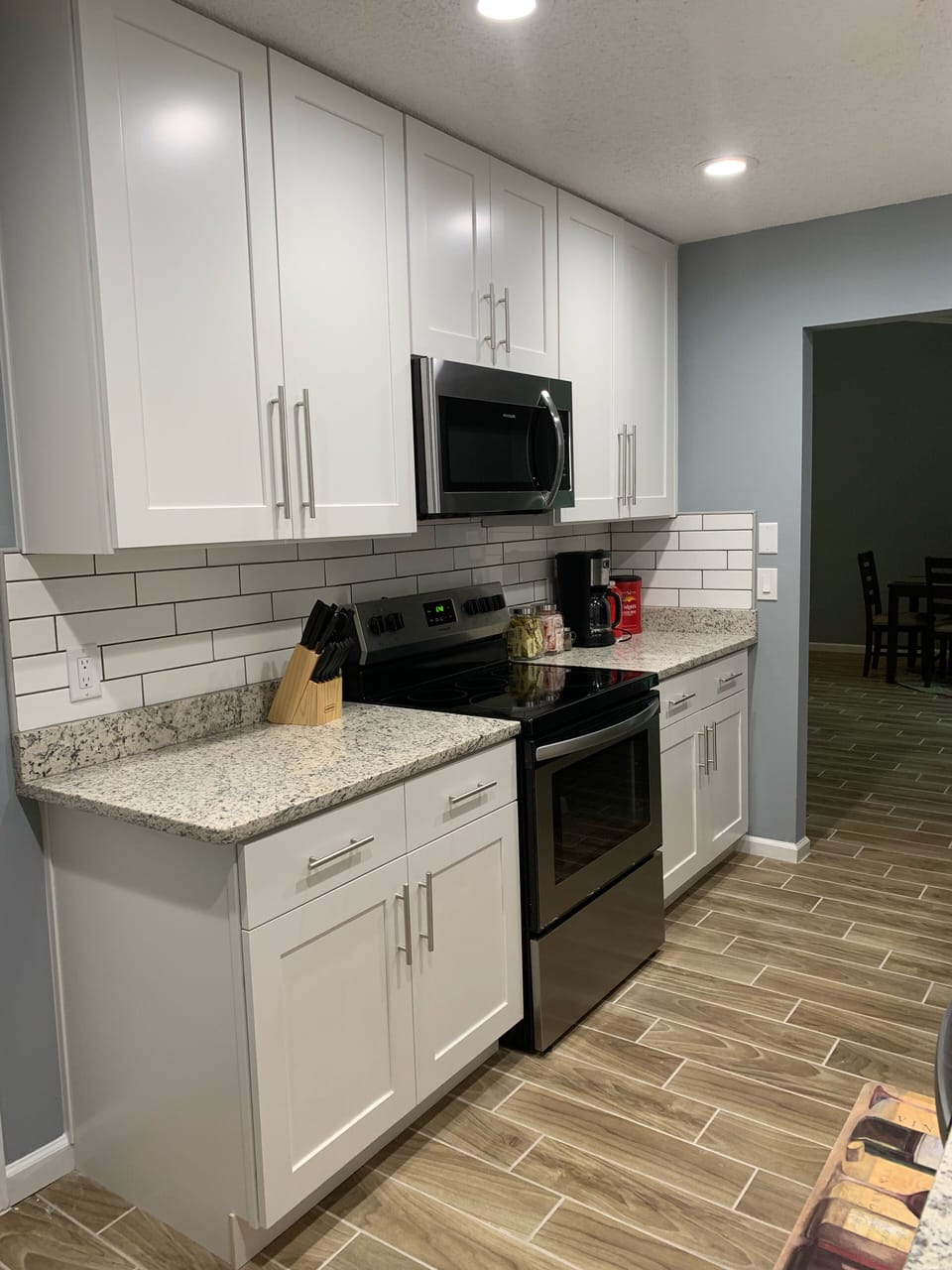 Granite counter top with 42” White shaker cabinets