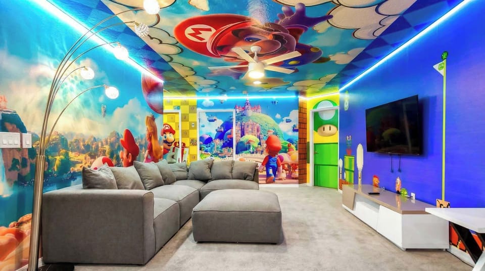 Colorful game lounge with themed walls, cozy seating, and fun for all ages.