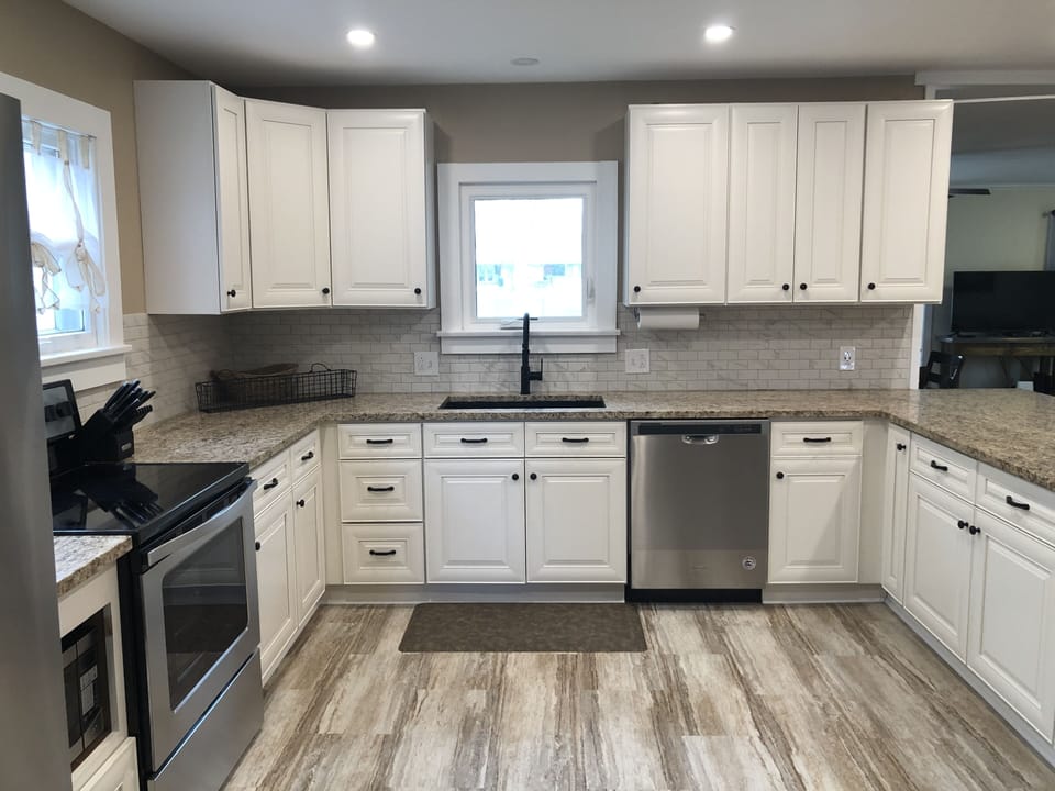 Newly remodeled kitchen with new appliances and a large island.