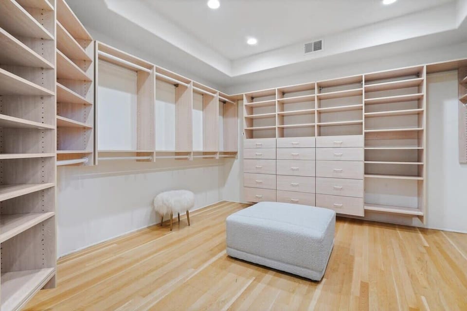 A spacious walk-in closet tailored to your storage needs.