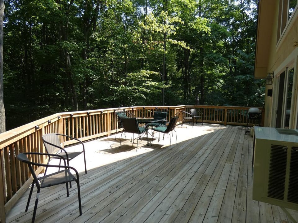 Beautiful deck with gas grill.