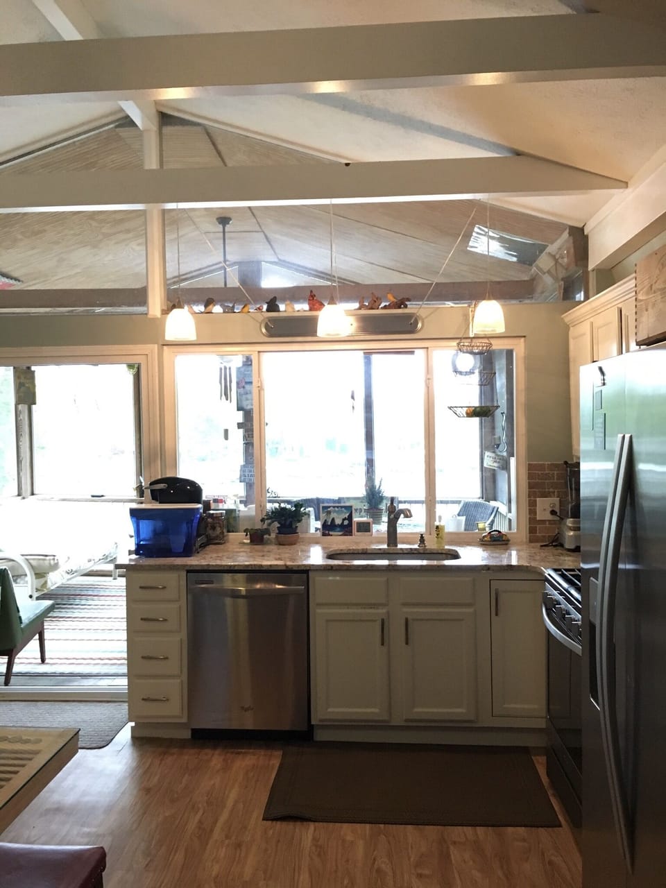 Kitchen overlooking screened in porch and right on the lake front. 