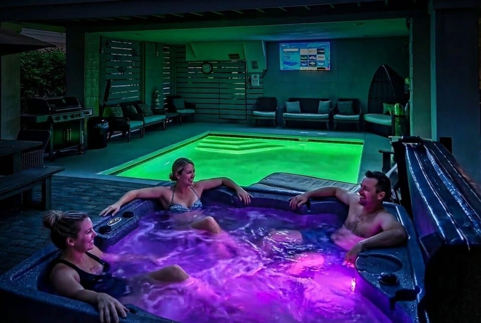 Free heated pool and hot tub both with color changing LED illumination.