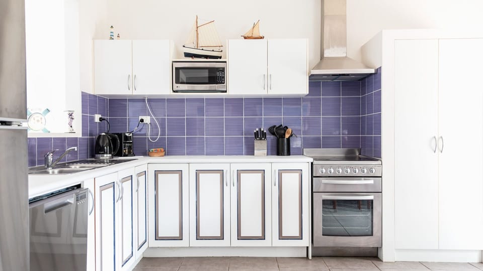 A modern and well-equipped kitchen with sleek stainless steel appliances.