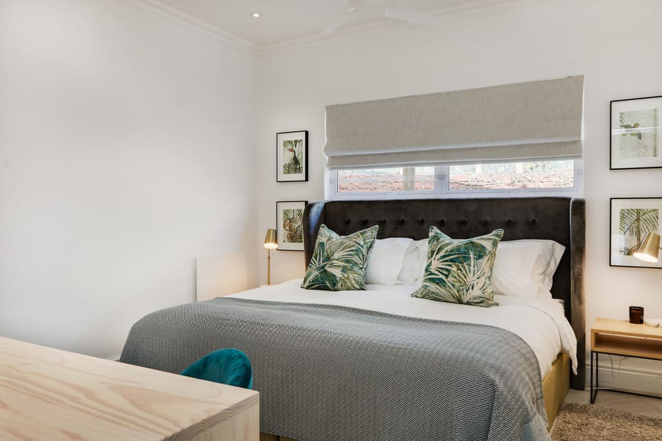 King bed, wall heaters, ceiling fan, luxury linen