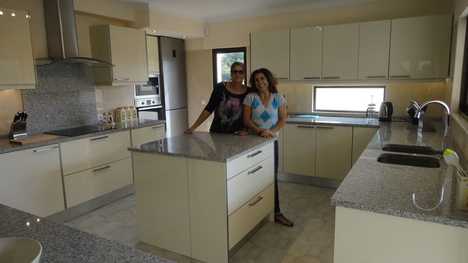 Our new kitchen with our maids that look after the villa