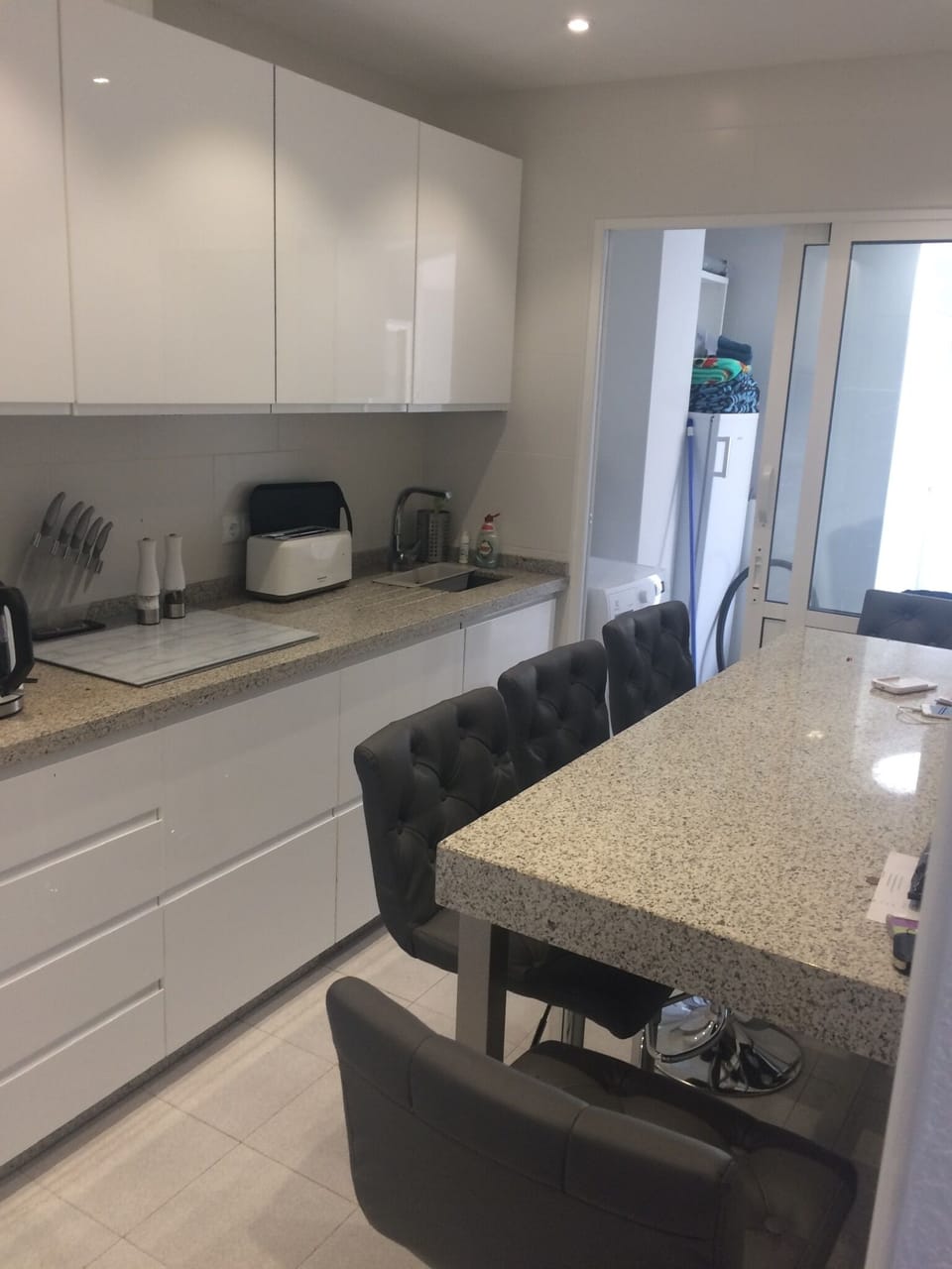 5 chrome  kitchen stools and granite table