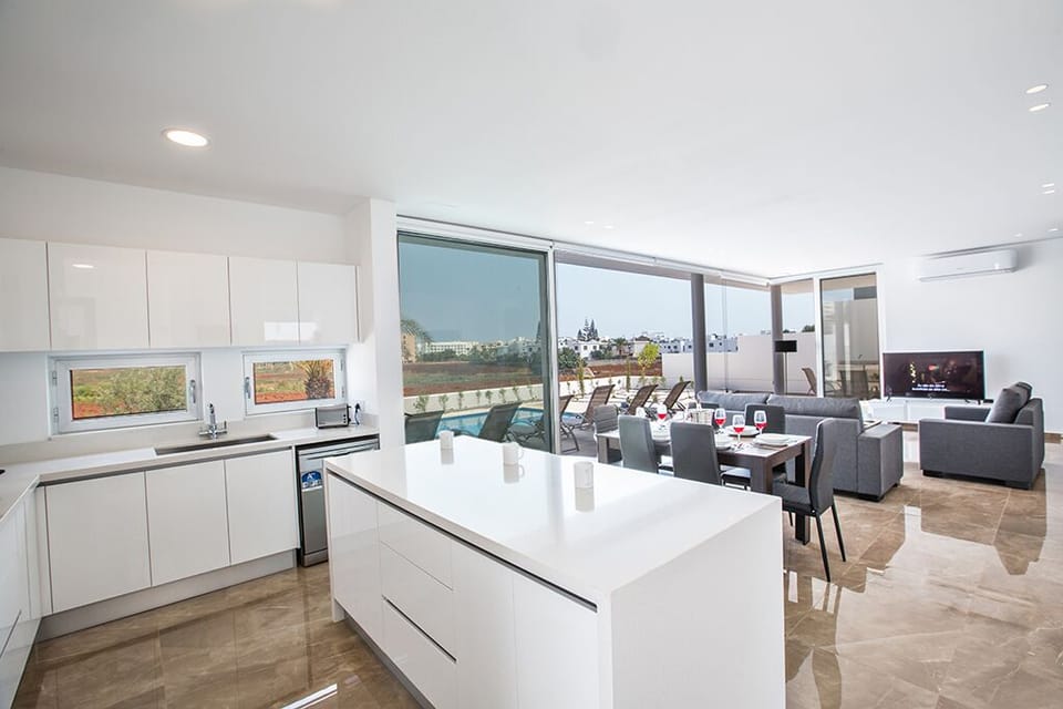 Modern kitchen with breakfast bar with seating for 3 persons