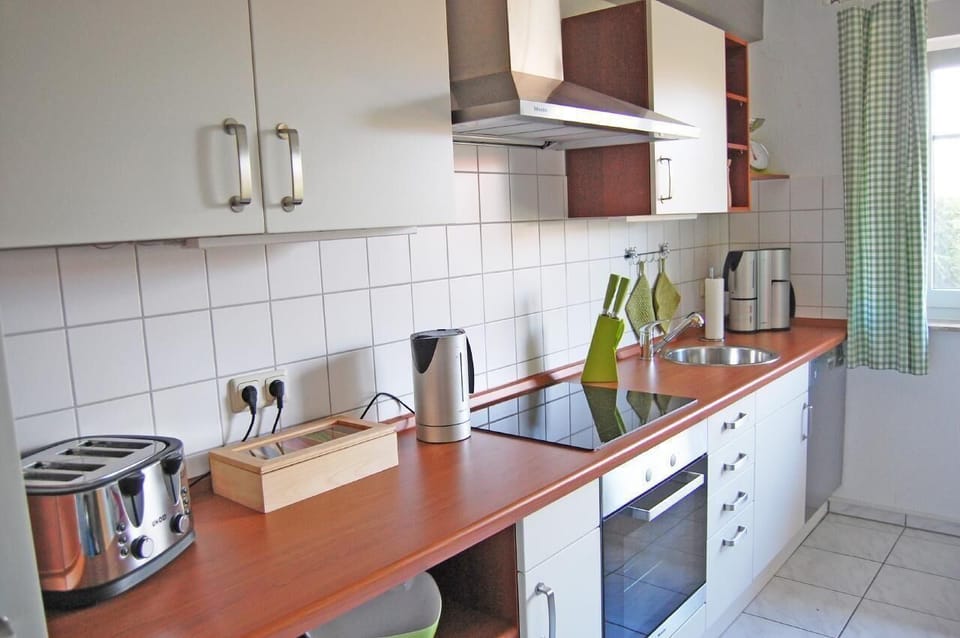 Top equipped Nolte kitchen with 2 fridges, microwave, toaster, coffee machine and dishwasher.