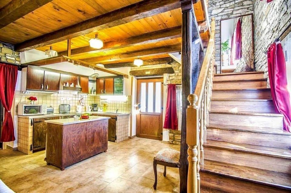 The kitchen and the staircase to go up to the first floor