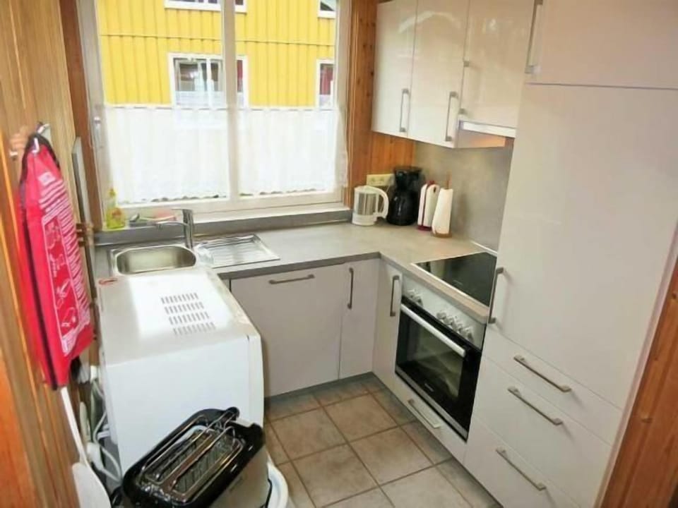 Kitchen fully equipped with dishwasher