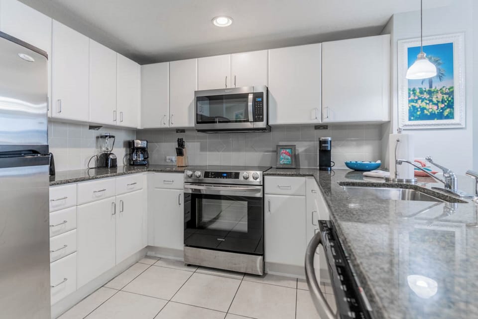 Your fully equipped kitchen features granite counters and modern appliances for memorable meals.