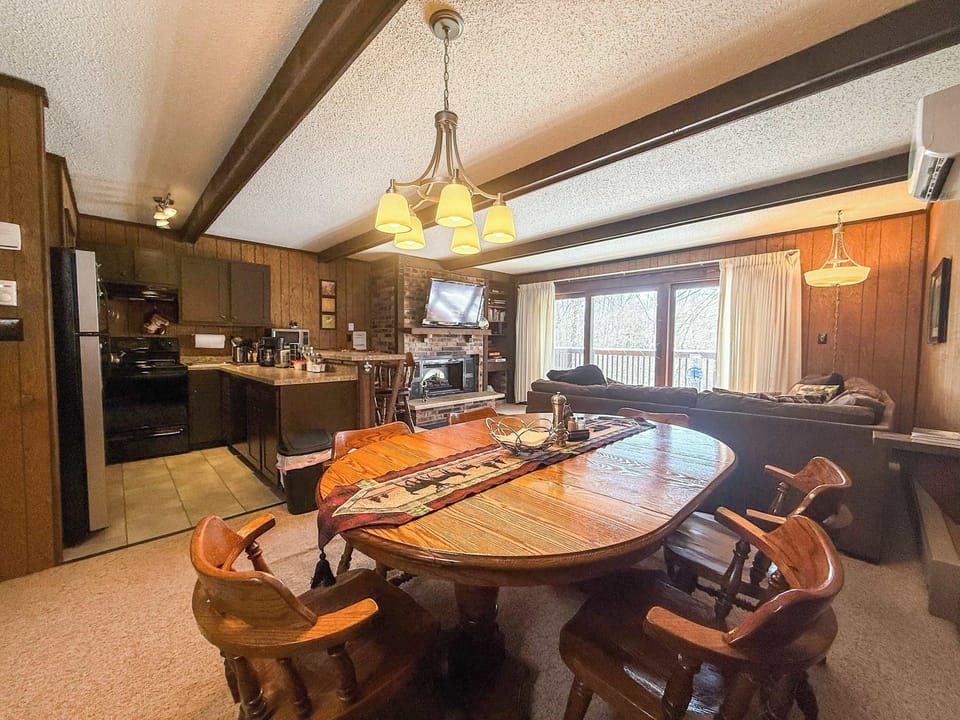 Open-concept kitchen, dining and living area at Cabin Fevers near Big Powderhorn
