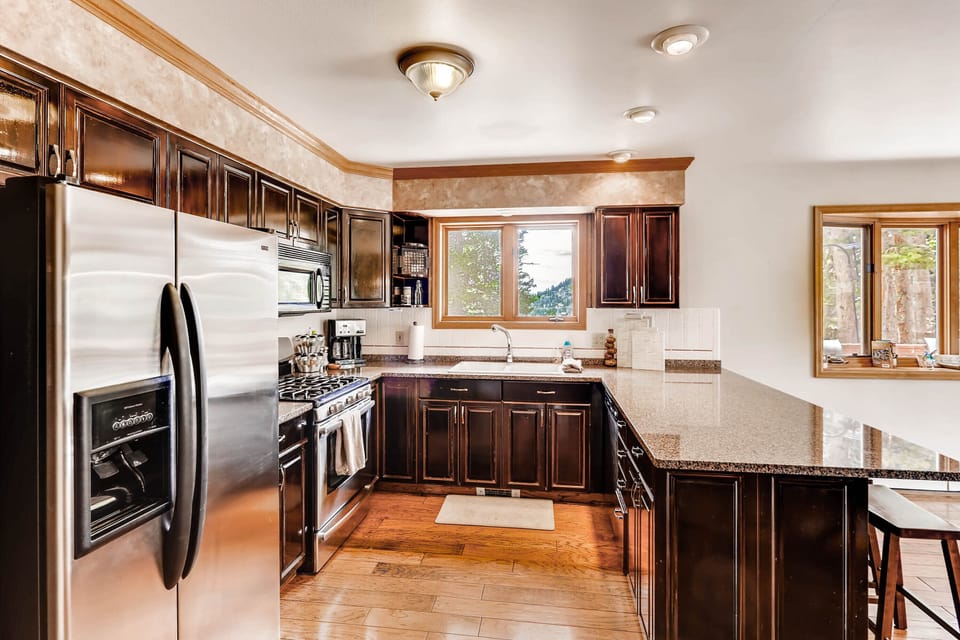 The large kitchen beautiful granite counter tops and stainless appliances. It is open to the great room and dining room.