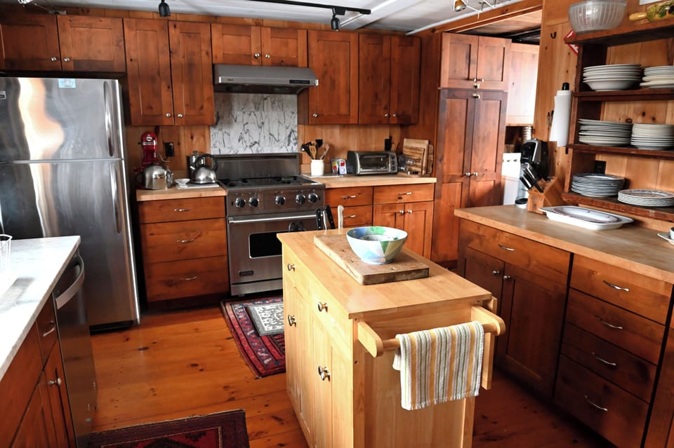 Kitchen. Viking stove. Marble and wood counters.