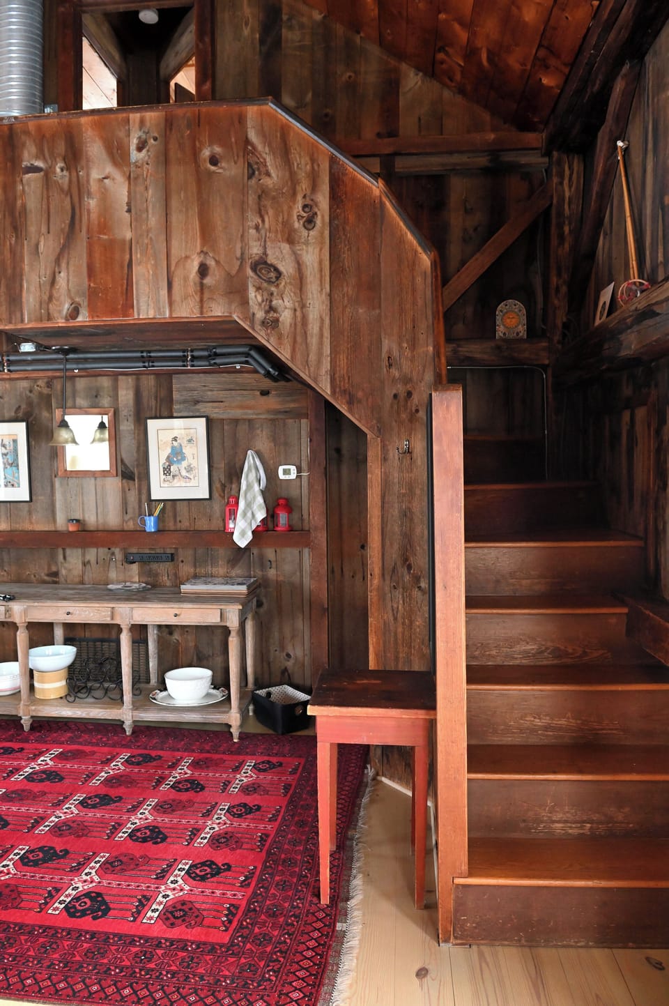 Dining area; stairs to 2 bedrooms. Under the stairs, closet and door to bathroom