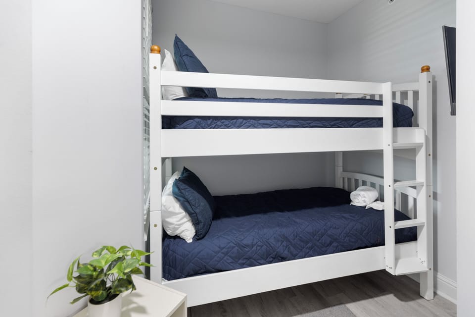Sleep soundly in your cozy bunk bed setup, perfect for families or friends sharing adventures together.