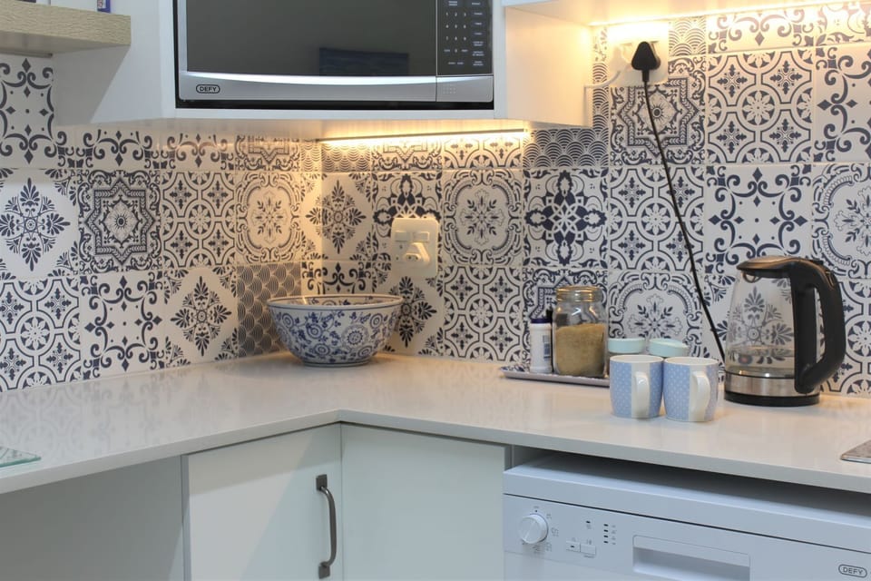 Kitchen with dishwasher, microwave and stove 