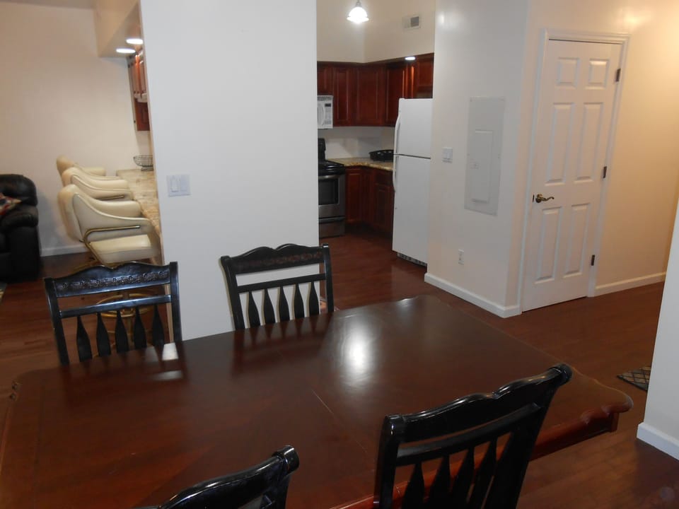 Dining area with clothes washing and dryer inside the shown door. 