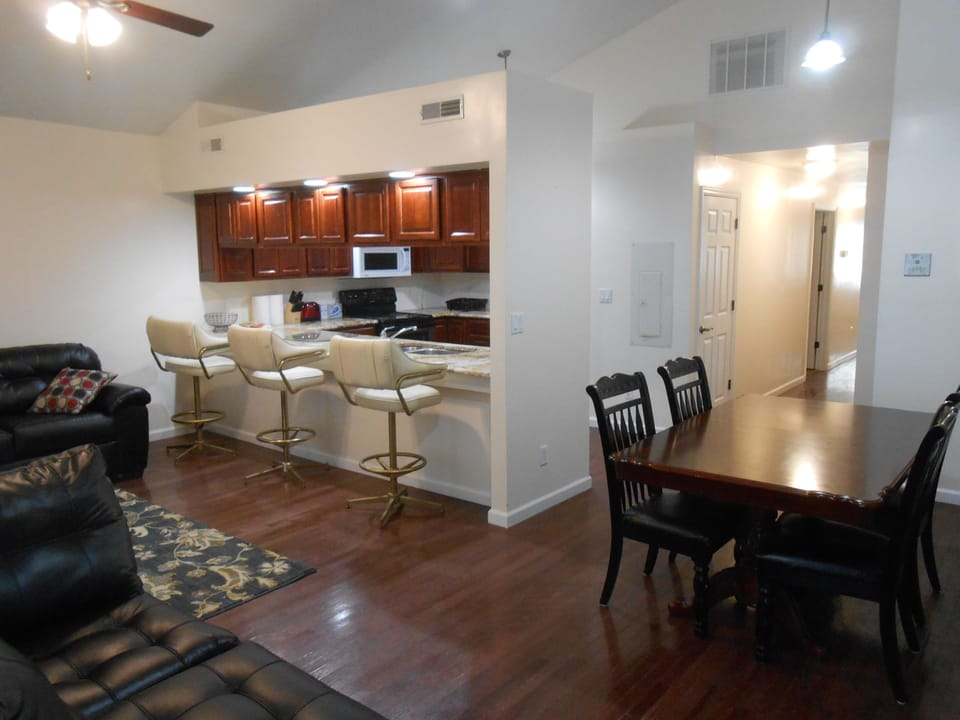 Living/dining area with view to the kitchen.