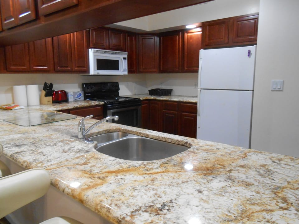 Plenty of storage and stocked cabinets with all your needs.