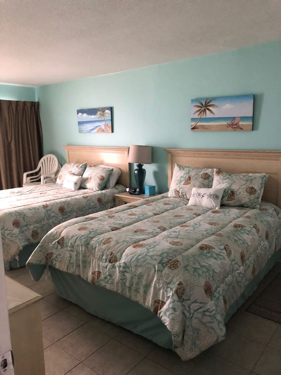 Master bedroom w/ 2 Queen beds and giant 8 foot window to watch the sunrise. 
