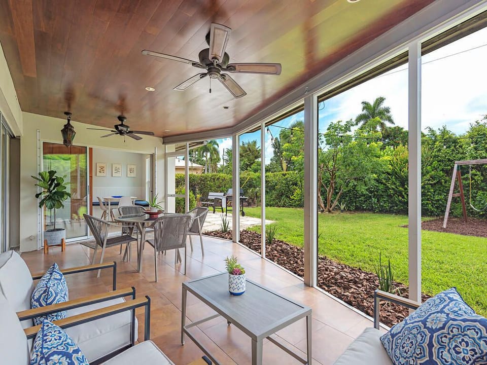 Screened Lanai looking onto outdoor grill area.