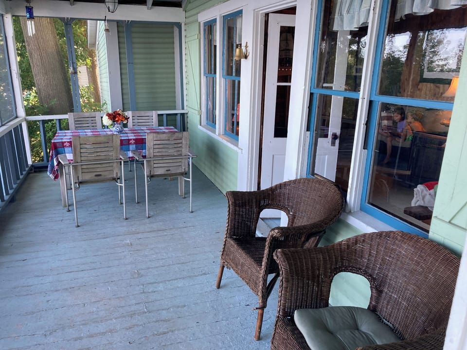 Screened in porch with overhead fans.