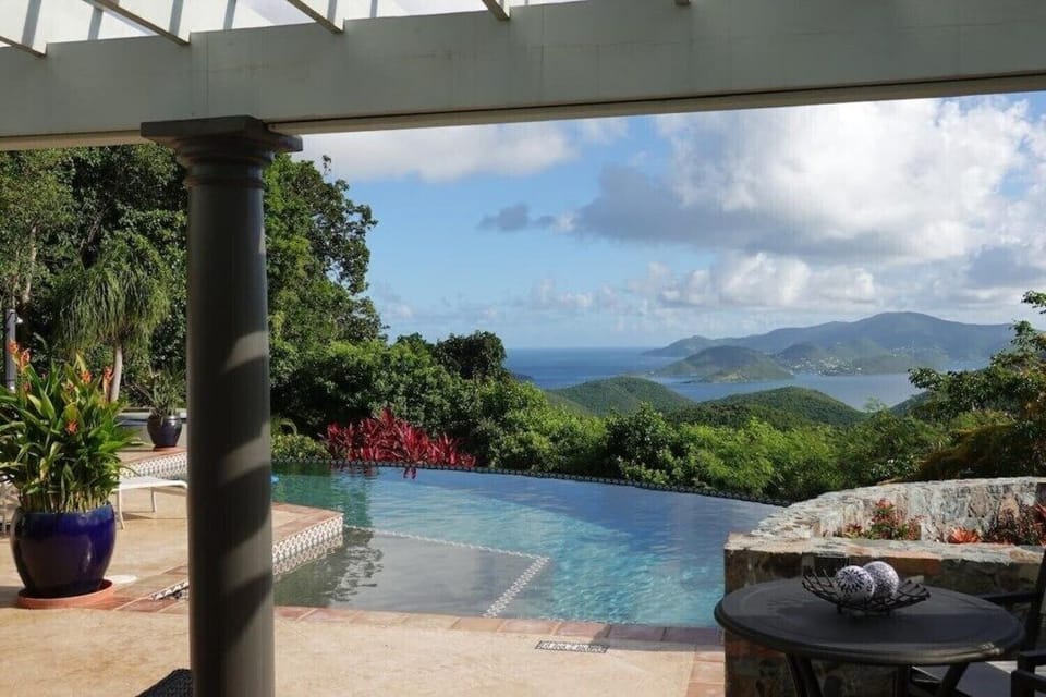 Cinnamon Day Dreams is perched atop Cinnamon Bay with views of Tortola BVI on the horizon