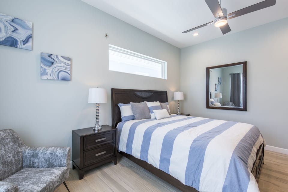 Second floor guest bedroom with queen bed