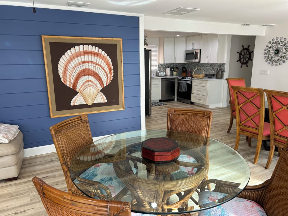 Seating for 10 to eat/play games all easily accessible to kitchen & living areas