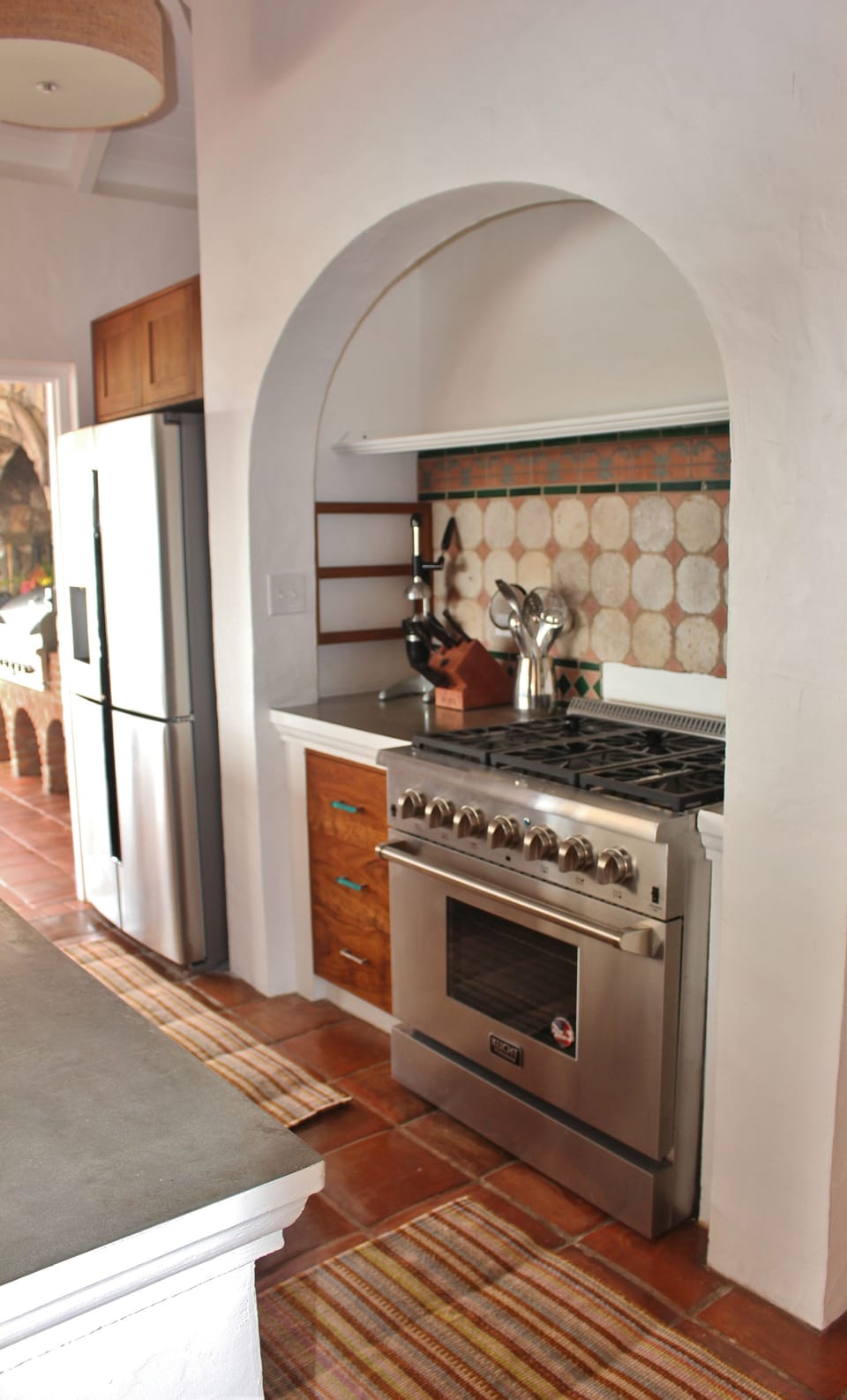 Kitchen with all new appliances, teak cabinets and polished cement countertops