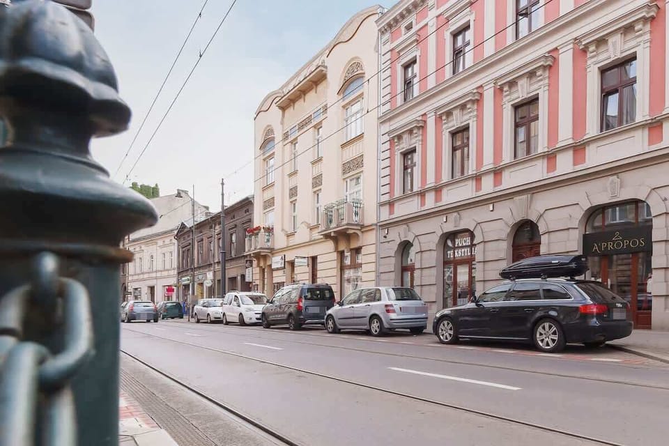 Another street view of the building’s surroundings, capturing the charm of the neighborhood with its traditional architecture.