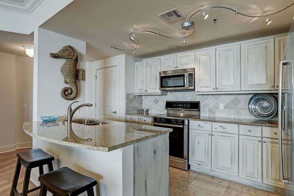 Open kitchen with counter dining.