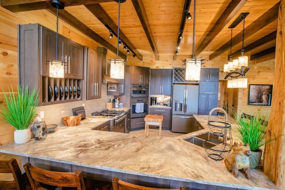 High end granite, custom knotty hickory cabinets & everything you will need!