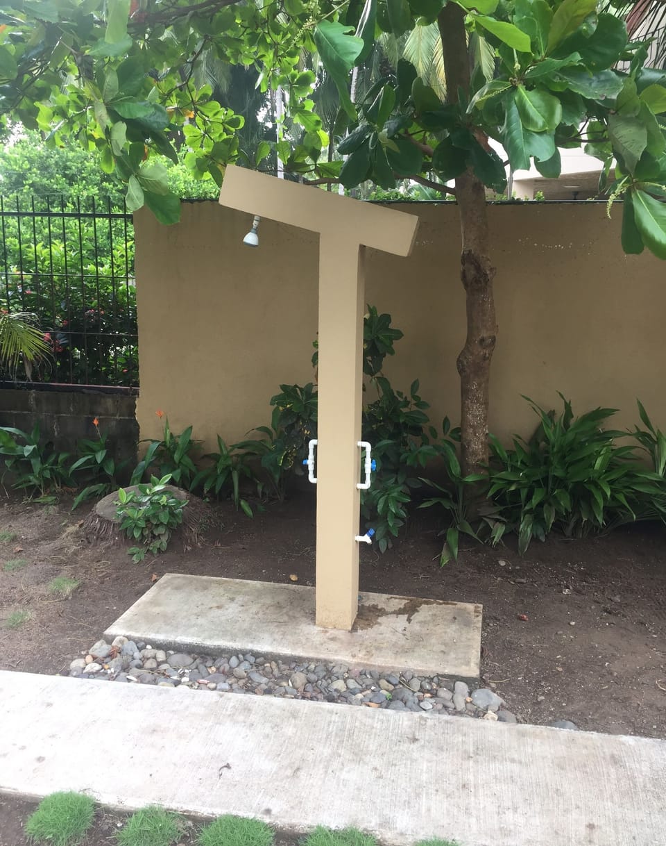 Outside shower near pool for rinsing off sand from beach