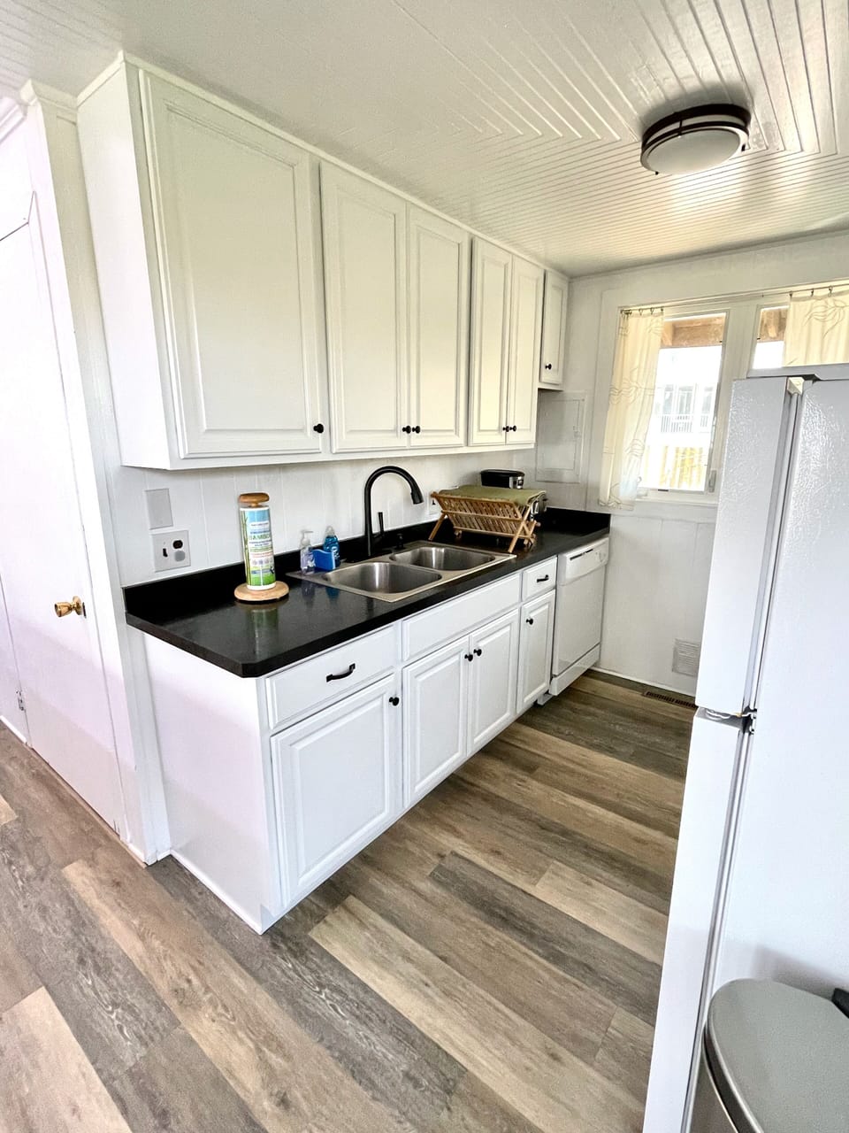 Updated kitchen with plenty of cabinet space. Dishwasher!